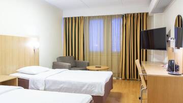 Фото номера Двухместный номер «Комфорт» с 2 отдельными кроватями Отель Torget Aparthotel г. Пори 2