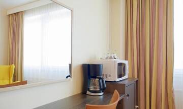 Фото номера Двухместный номер с 2 отдельными кроватями Отель Torget Aparthotel г. Пори 8